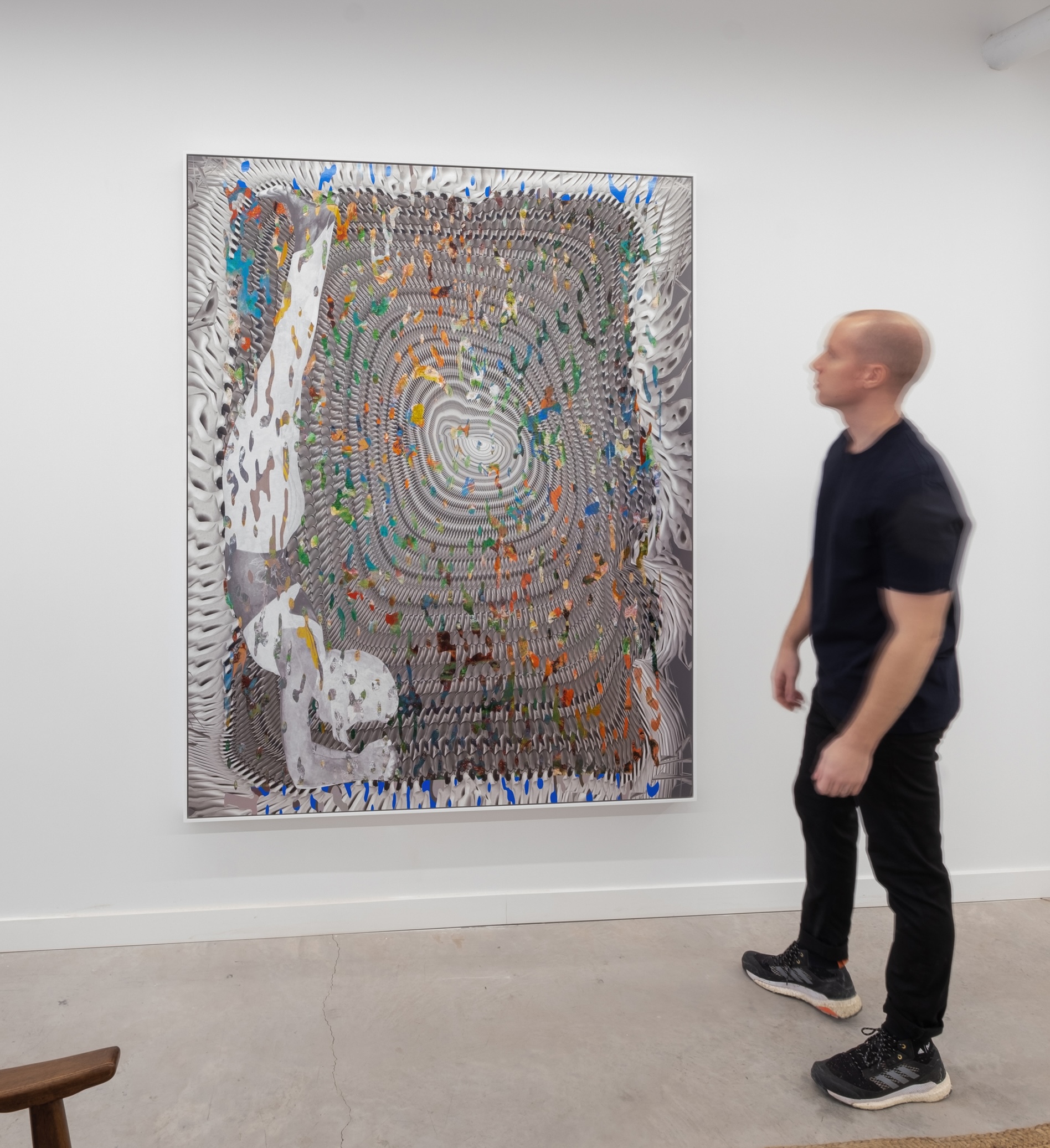 Alex Fischer standing beside untitled (Print), 2019, 73 × 58 inches